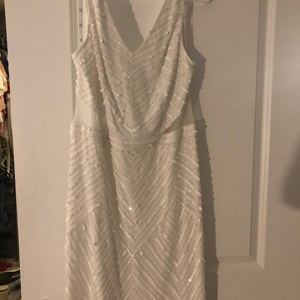 White sequin mini dress with side sheer cutouts